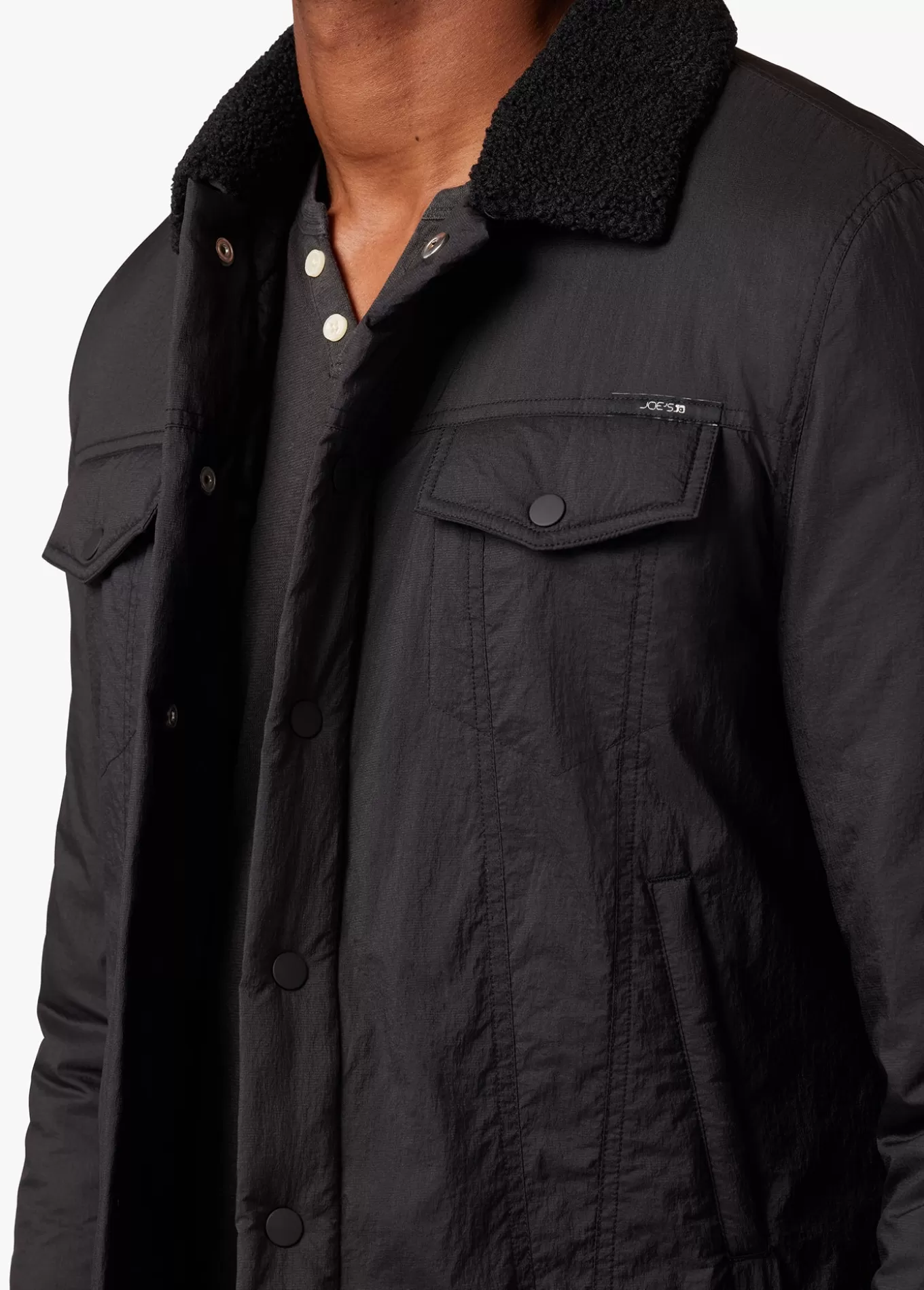 quilted_black_trucker_jacket_445.webp Joe’s Jeans QUILTED BLACK TRUCKER JACKET